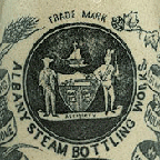 Stamp or Paper-based Glaze on a Pottery Bottle